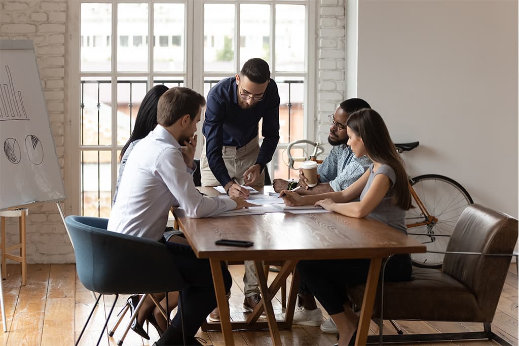 Diverse business team working at group meeting in modern office